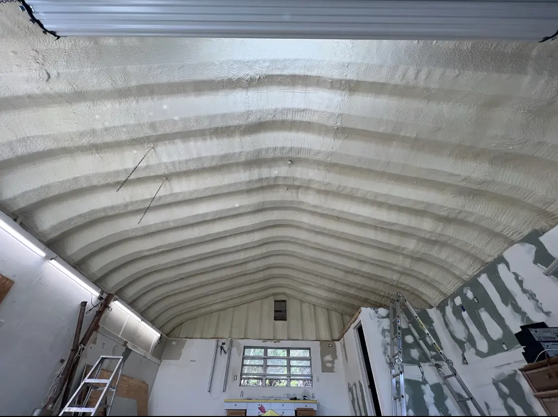 Spray polyurethane foam applied to the underside of a metal roof deck in Woodland Park